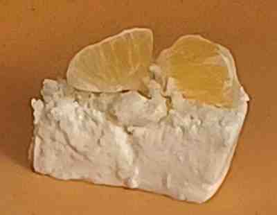 A piece of orange yogurt cake